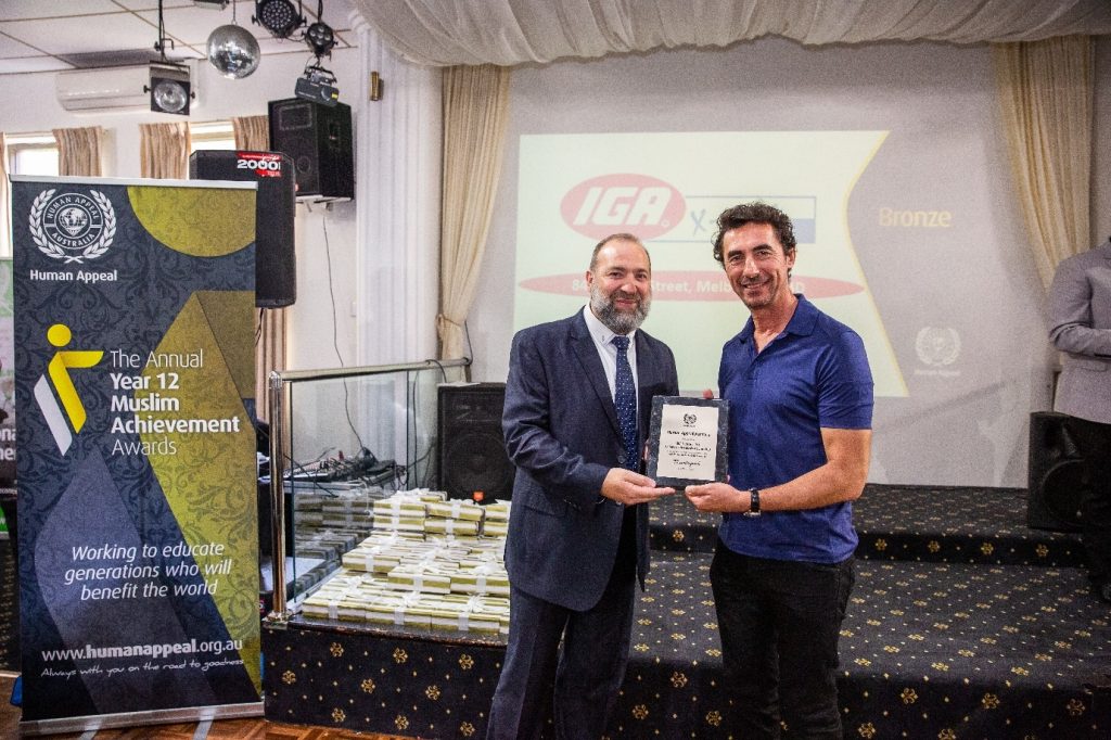 Platinum sponsor representative awarding an hsc high achiever